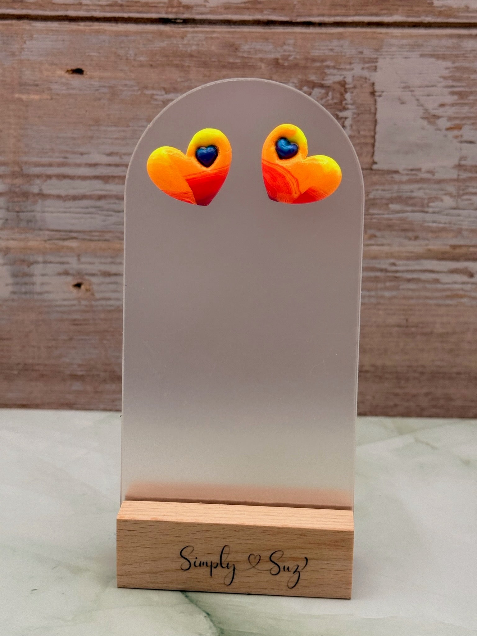 Sunset Swirl Heart Studs with Blue Heart Accent