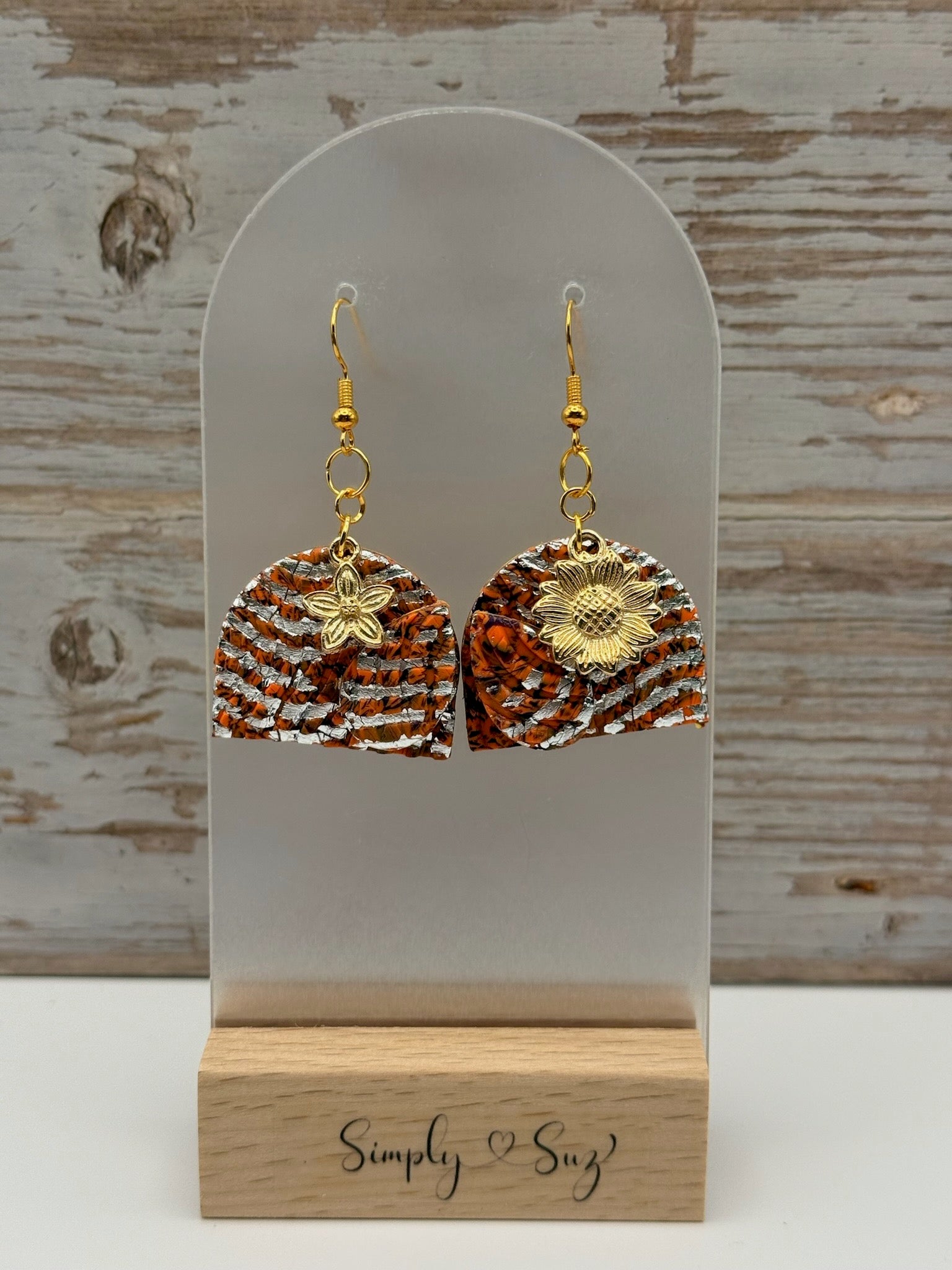 Orange Textured Arch Dangles with Gold Flower Charms